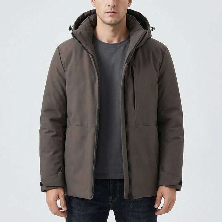 Rain-resistant hooded windbreaker, ideal for hiking, camping, and outdoor adventures in cold weather.