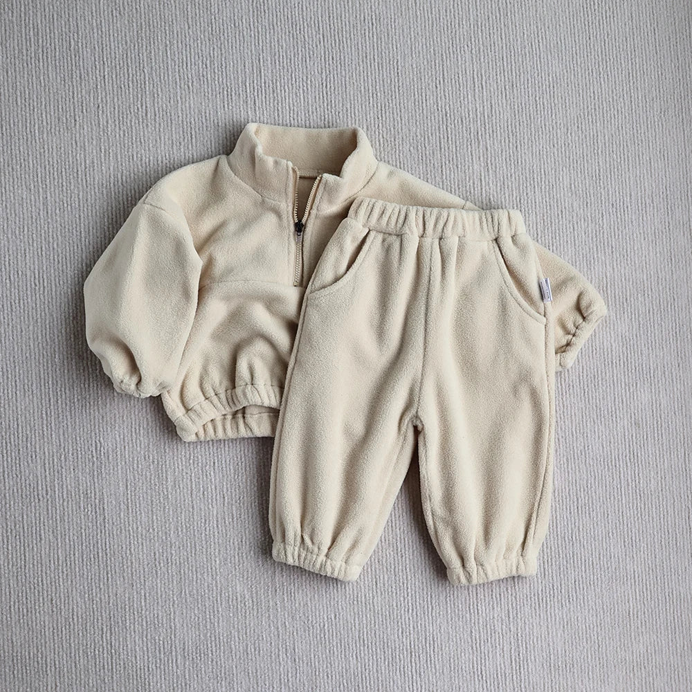 Close-up of a toddler fleece hoodie, showing soft texture, unisex baby clothing