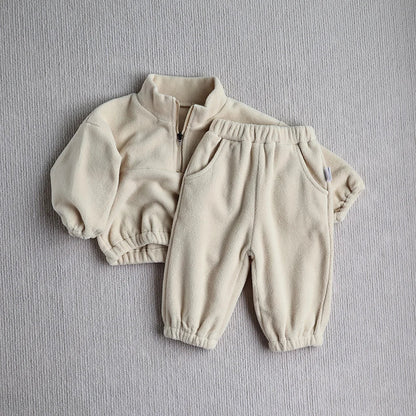 Close-up of a toddler fleece hoodie, showing soft texture, unisex baby clothing