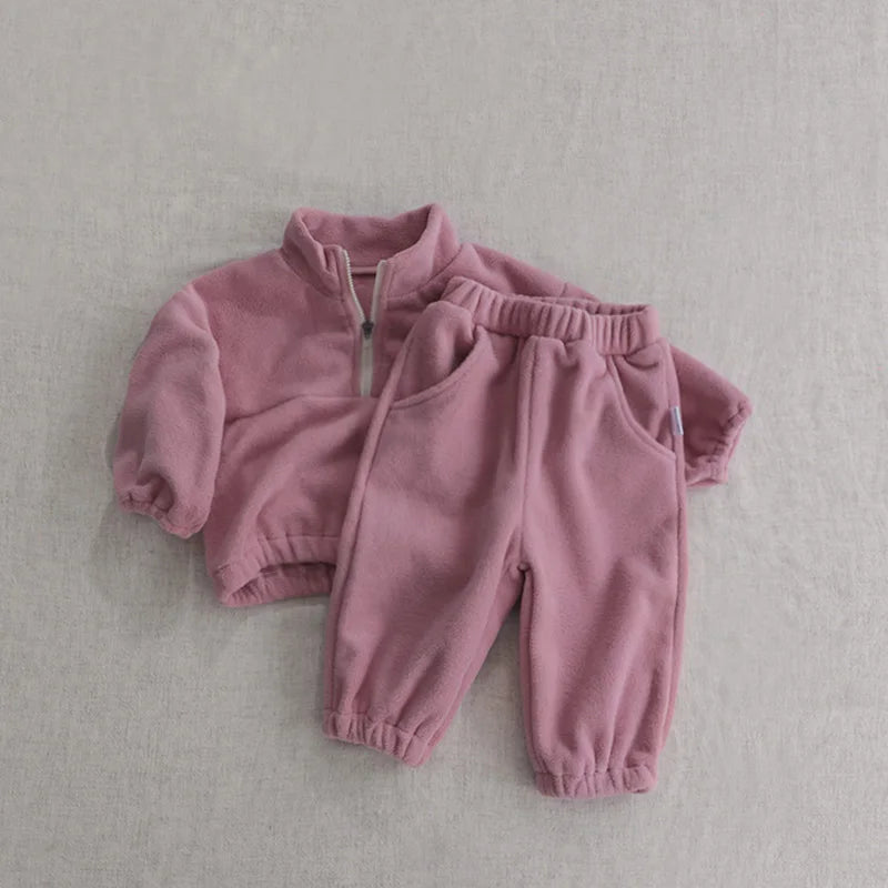 Full shot of a unisex toddler fleece track suit, comfortable baby sports outfit