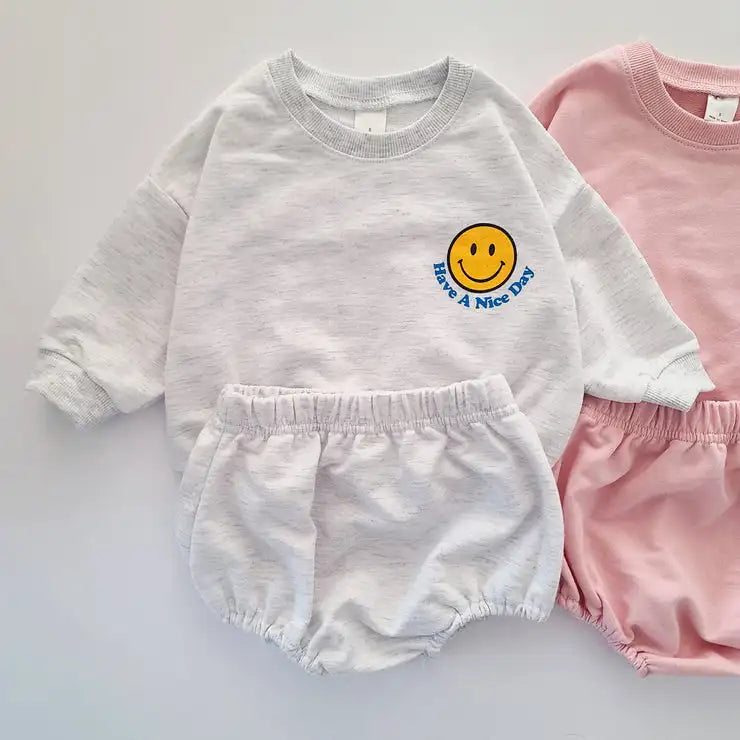 Comfortable playwear ideal for spring: toddler smiley face sweatshirt and short pants set