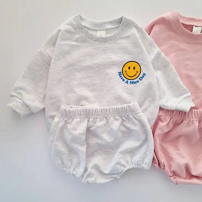 Comfortable playwear ideal for spring: toddler smiley face sweatshirt and short pants set