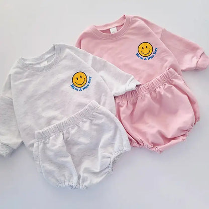 Toddler cotton long-sleeve sweatshirt with yellow smiley face graphic and matching shorts