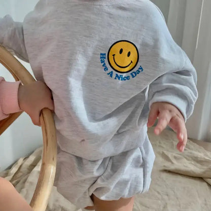 Cute autumn wear: toddler unisex smiley face sweatshirt and matching short pants