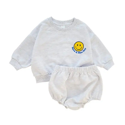 Detail of the soft cotton fabric of the unisex toddler sweatshirt and short pants set