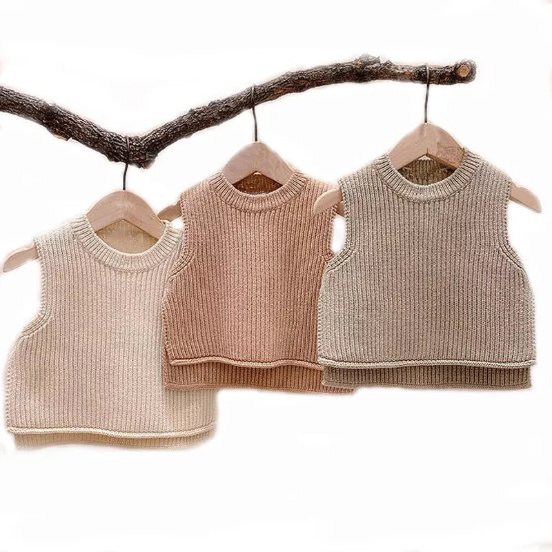 Unisex toddler solid knit vest in a warm autumn color, perfect for layering baby outerwear.