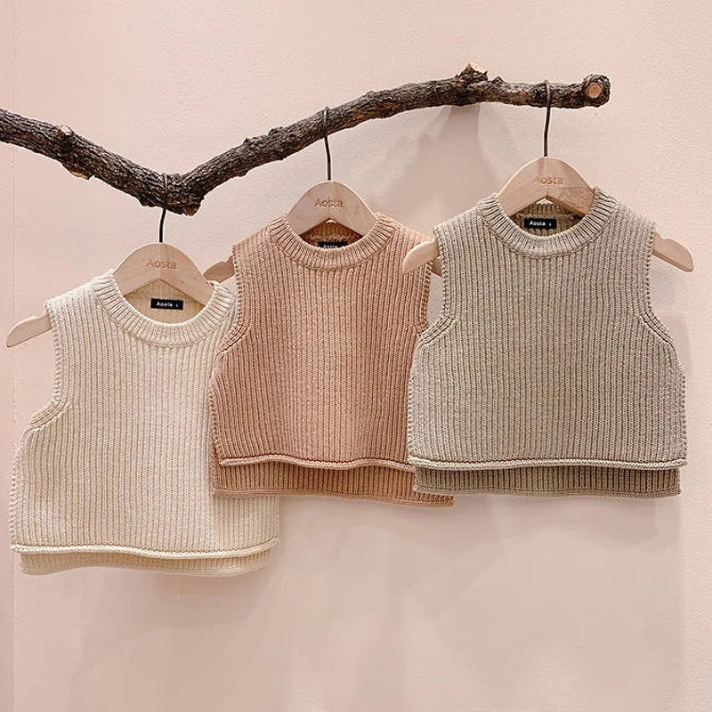 Warm knit vest for toddlers, providing comfort and style as baby outerwear.