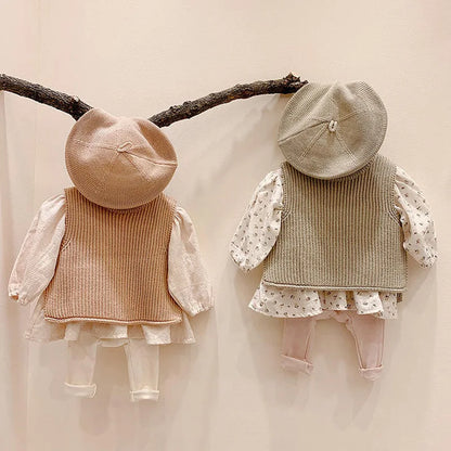 Soft cotton knit vest for toddlers, a cozy and stylish sleeveless outerwear piece for fall.