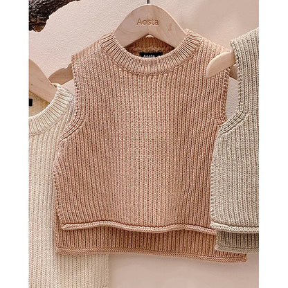 Solid knit toddler vest, an essential autumn fashion item for unisex baby layering.