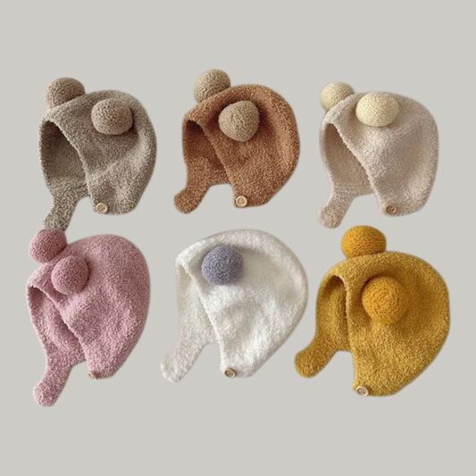 Unisex toddler warm fleece earflap hat with pom-pom, perfect for winter baby warmth.
