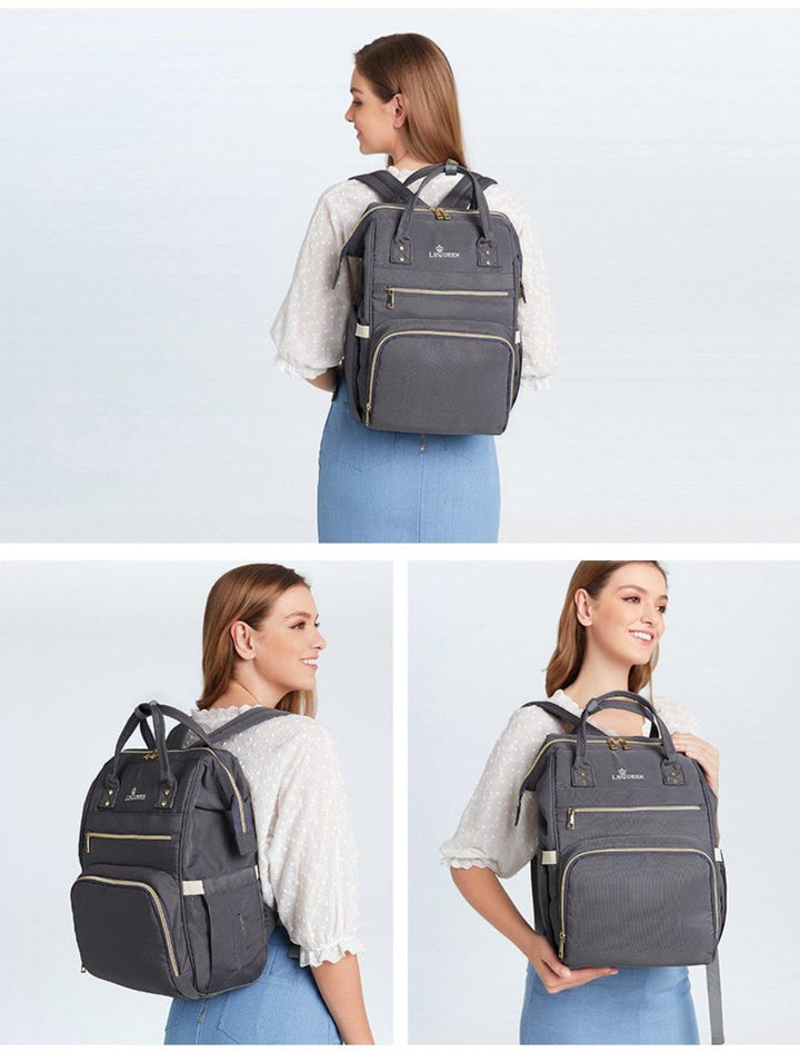 Stylish unisex travel diaper backpack, ideal for parents on-the-go. Spacious & water-resistant baby gear.