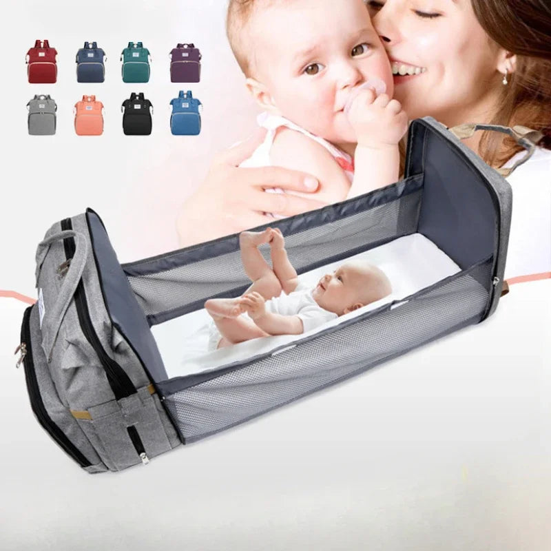 Unisex travel diaper bag with integrated foldable baby crib for on-the-go parents.