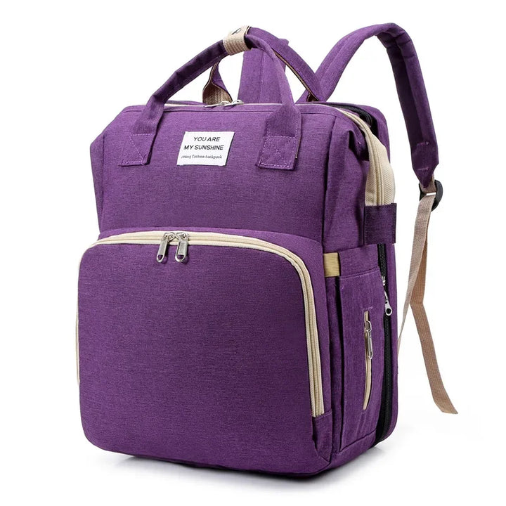 Smart baby travel solution: a diaper bag that unfolds into a crib and changing station.