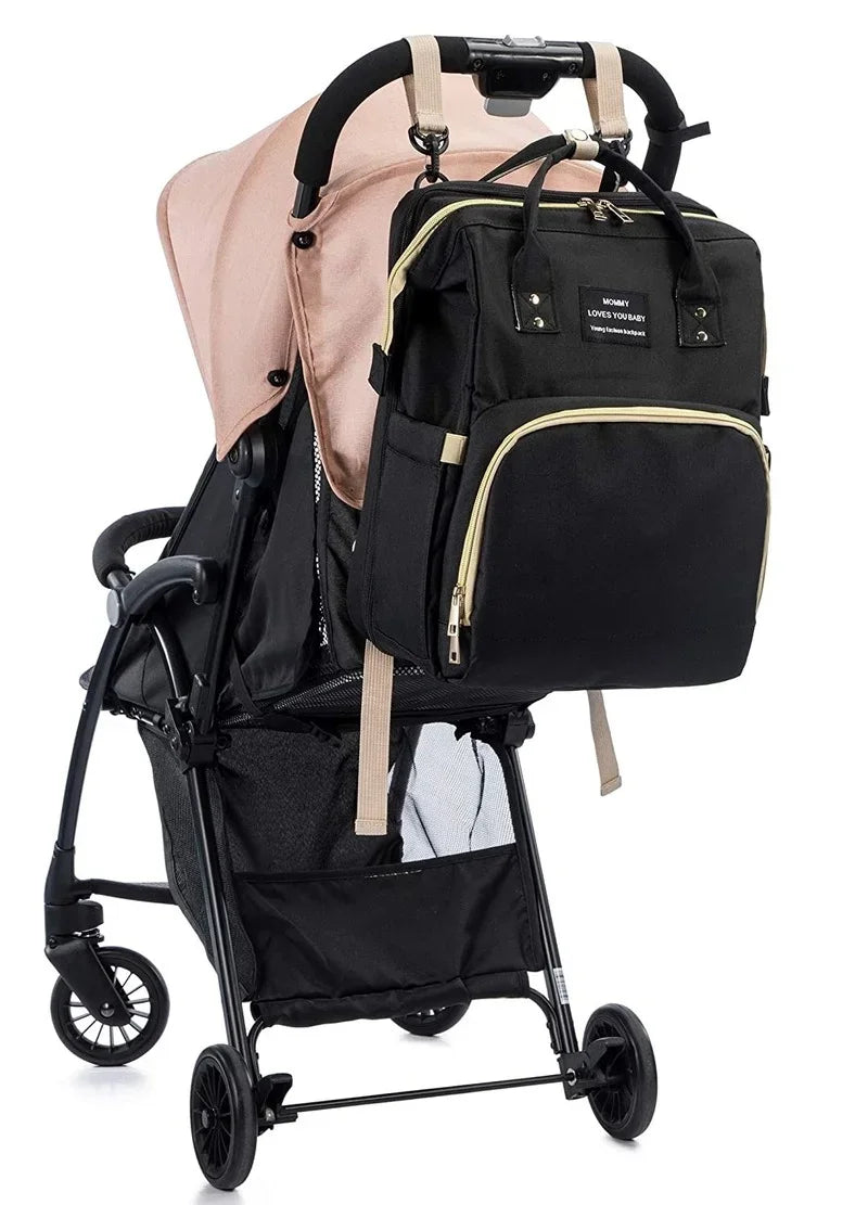 Keep baby comfy anywhere with this unisex travel diaper bag, crib & changing station.