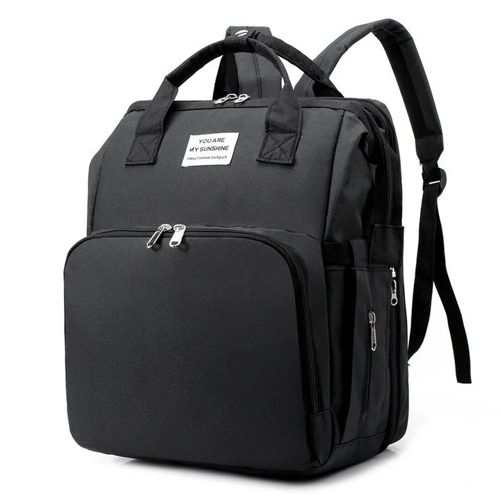 Essential parenting backpack: unisex diaper bag, foldable baby crib, changing station.