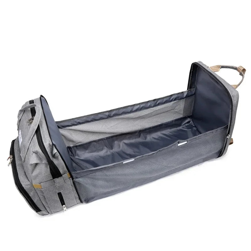 Stylish unisex travel bag, featuring a convenient foldable baby crib for travel.