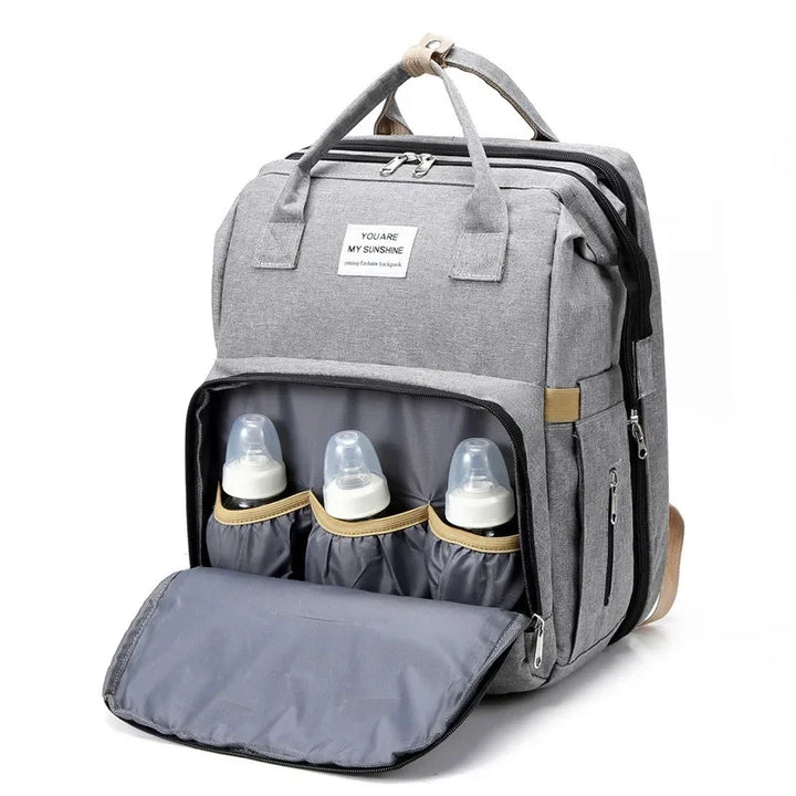 Baby essentials travel backpack with a built-in changing station & comfy crib.