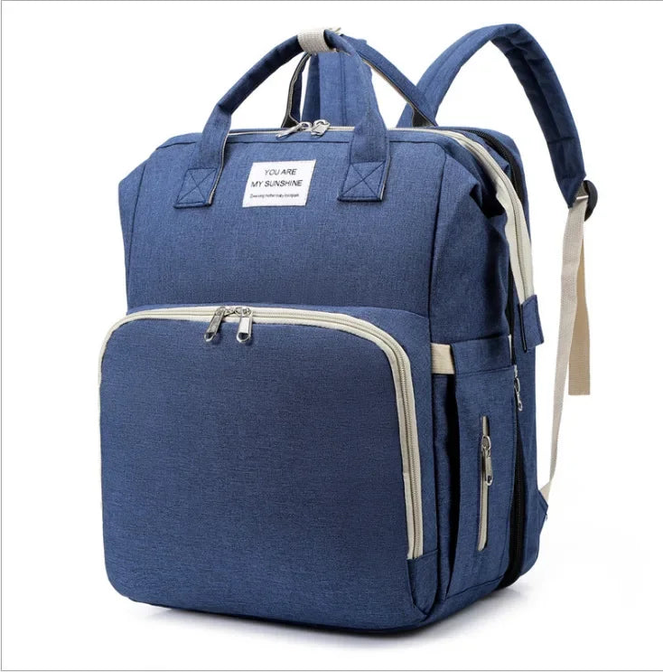 Innovative unisex travel diaper bag, perfect for baby travel with changing station & crib.