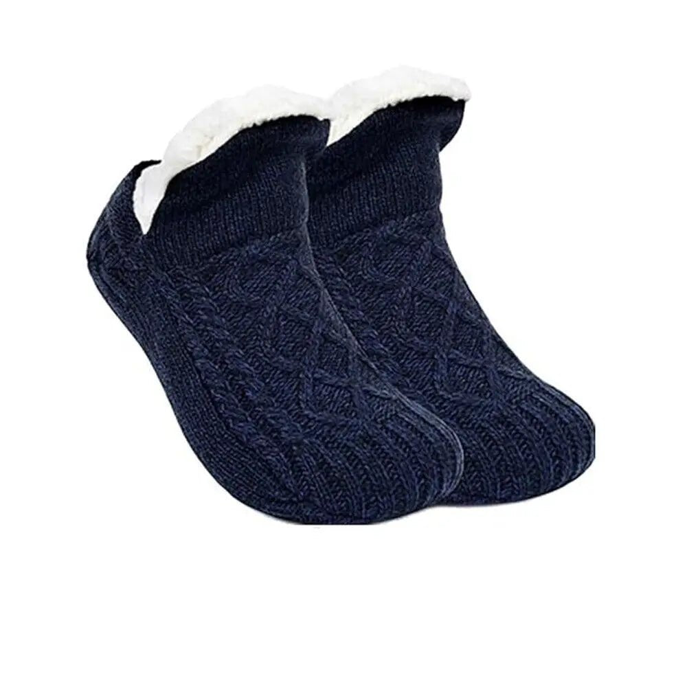 Relaxing in ultra-soft cozy house socks, perfect for lounging and ultimate indoor foot comfort.