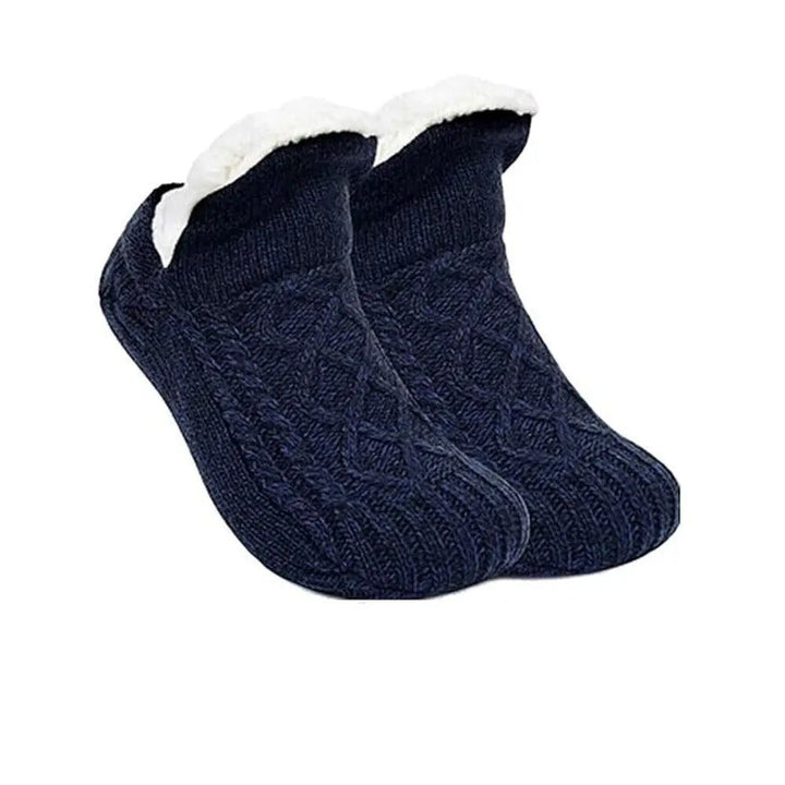 Relaxing in ultra-soft cozy house socks, perfect for lounging and ultimate indoor foot comfort.