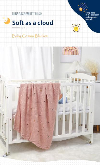 Cotton knitted baby blanket in a soft grey, an all-season newborn essential for gentle comfort