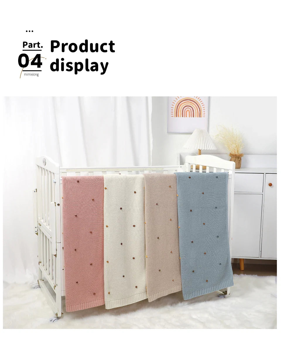 Baby blanket displayed against a light background, highlighting its neutral tone and versatile use