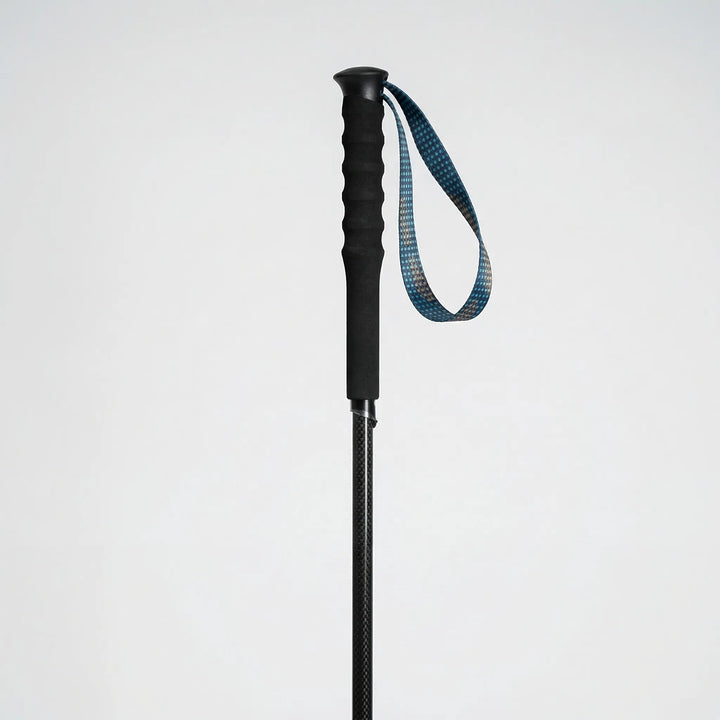 Lightweight carbon fiber trekking poles, ultralight and strong, ideal outdoor gear for any hiking trail.