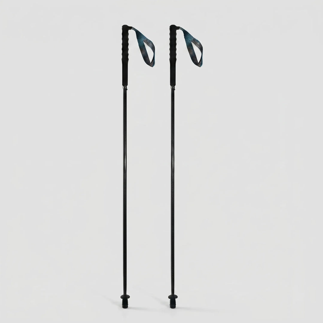 Extended unisex collapsible carbon fiber poles, ready for challenging trekking, hiking, or walking trails.