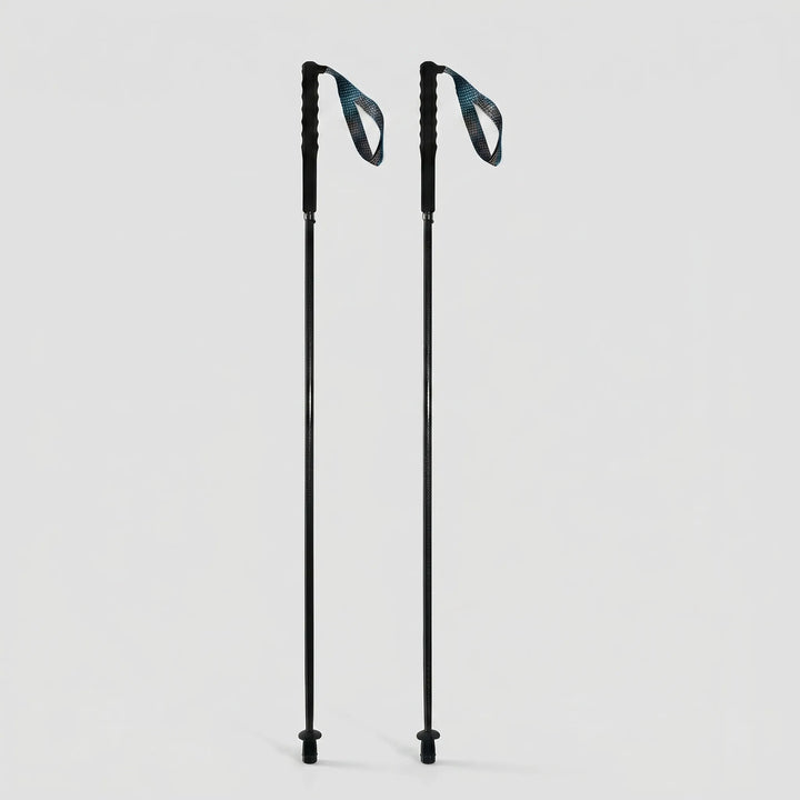 Extended unisex collapsible carbon fiber poles, ready for challenging trekking, hiking, or walking trails.