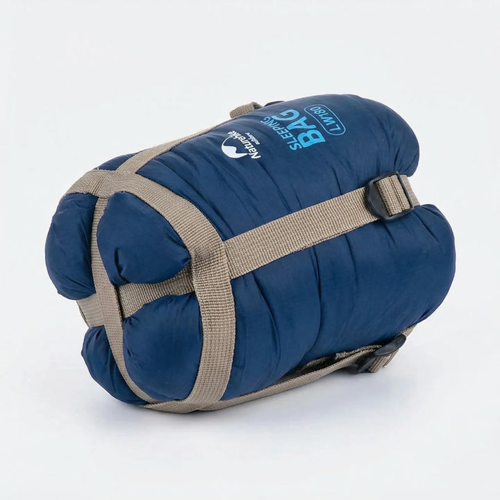 Packed ultralight summer sleeping bag, ideal compact gear for hiking & backpacking trips.