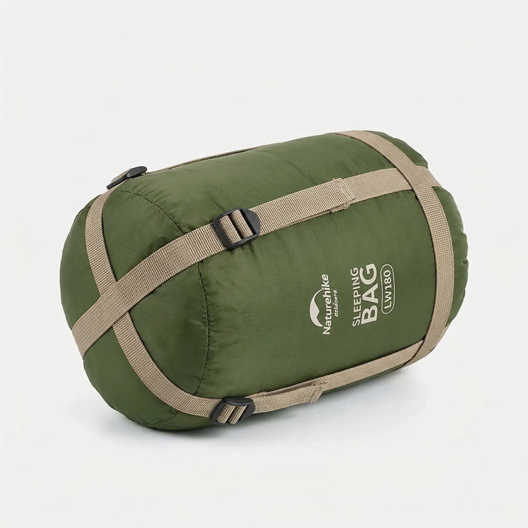 Open unisex summer sleeping bag in a scenic outdoor setting, ready for warm weather camping.