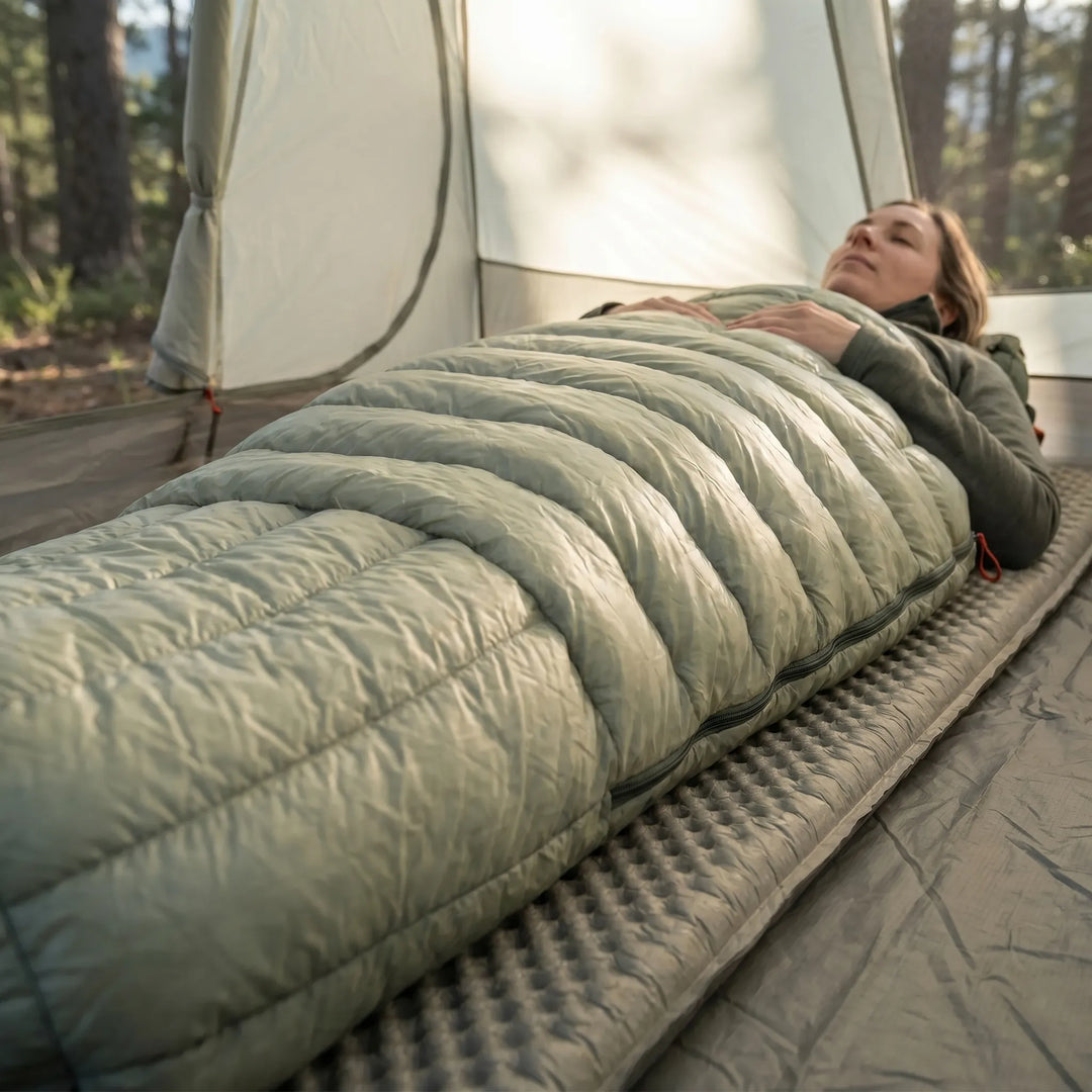 Ultralight down mummy sleeping bag, perfect for backpacking. Warm, compact, and insulated for outdoor adventures.