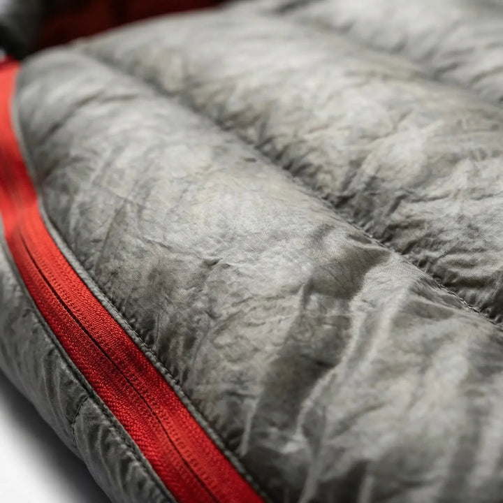 Durable Water Repellent (DWR) ultralight mummy down sleeping bag, ideal for wet backpacking trips.