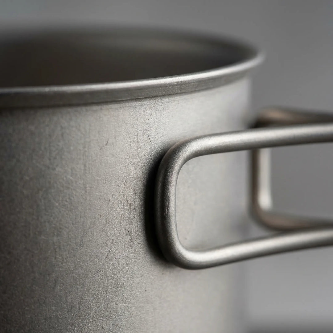 Durable ultralight titanium cookware set for outdoor adventures: hiking, camping, and backpacking.