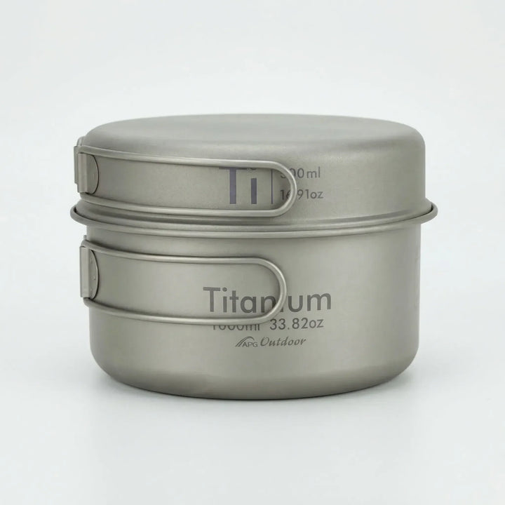 Compact titanium folding mess kit for camping, hiking, and backpacking; essential outdoor cookware.