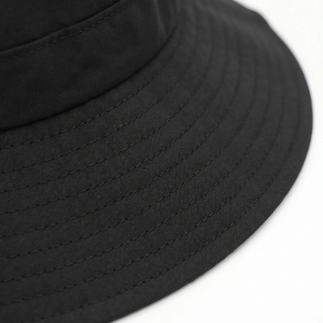 Ventilated outdoor bucket hat with adjustable chin strap, ideal for hiking, fishing, and watersports.