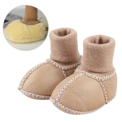 Close-up of a warm baby slipper with anti-slip sole, cozy infant footwear for toddlers