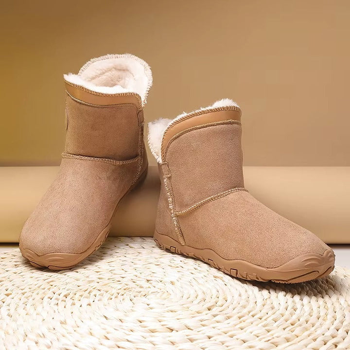 Plush interior of warm winter barefoot boots, ensuring cozy cold weather comfort.