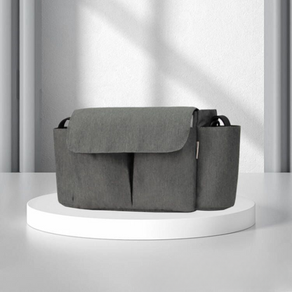 Durable stroller organizer for baby travel, featuring secure attachment straps.
