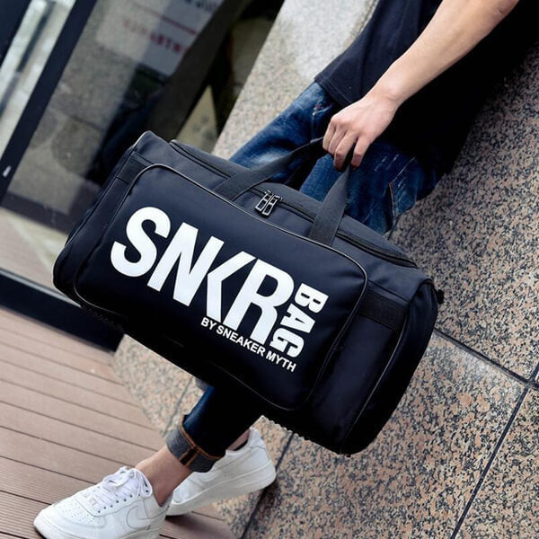 Unisex water-resistant sneaker travel bag with organized compartments for shoes & gear.