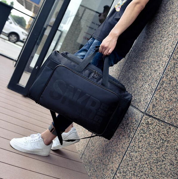Front view of the water-resistant sneaker & gear travel bag, showcasing its sleek design.
