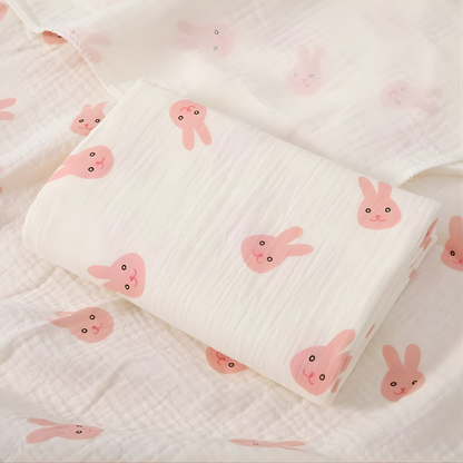 Close-up of a white cotton surfaced waterproof baby sleep mat for nursery use.