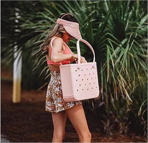 Unisex waterproof beach bag with drain holes, perfect for wet gear.