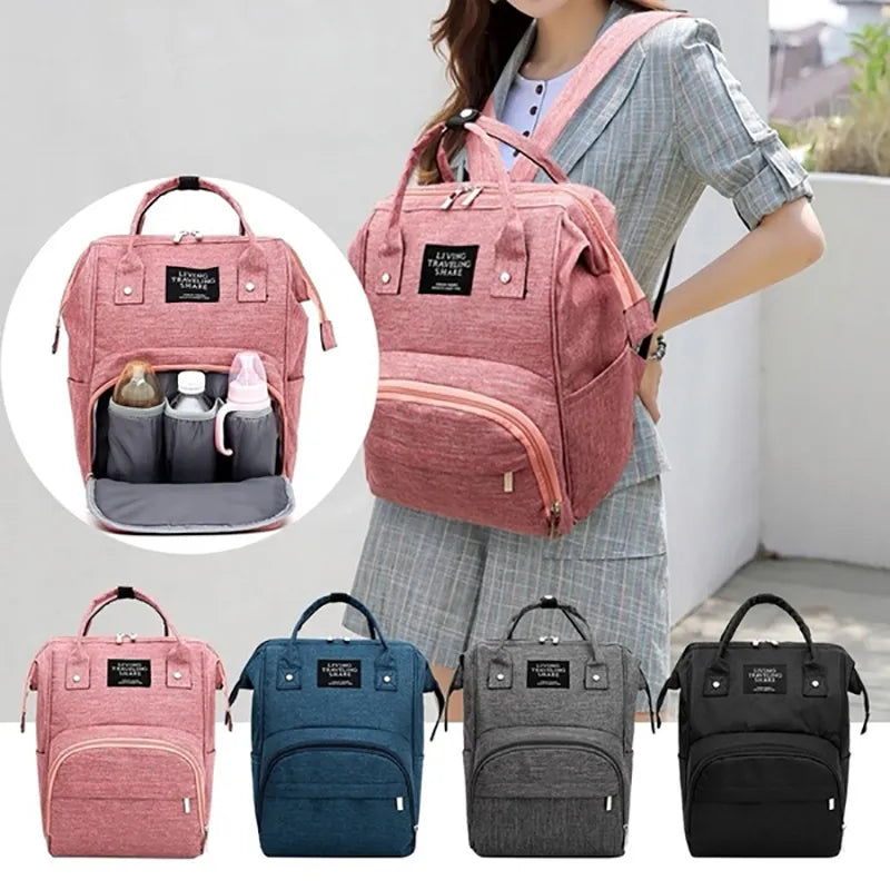 Unisex waterproof large capacity diaper backpack for parents, black with front pockets, ideal for baby travel.