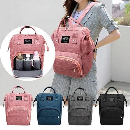 Unisex waterproof large capacity diaper backpack for parents, black with front pockets, ideal for baby travel.