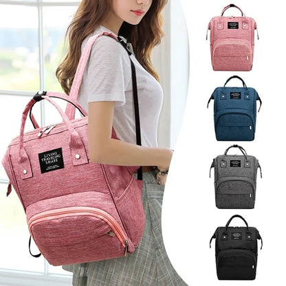 Side view of a large capacity waterproof diaper backpack, showcasing bottle pockets and sleek design, mom bag.
