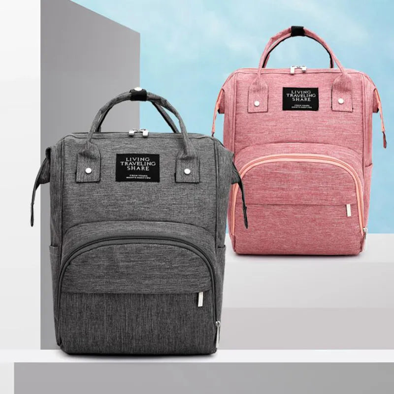 Diaper backpack with built-in changing pad, unisex and waterproof, essential for on-the-go parenting.