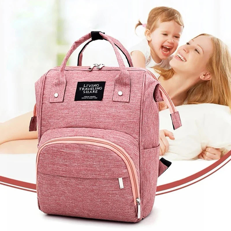 Detail of sturdy zippers on a waterproof diaper backpack, ensuring durability for baby bag users.