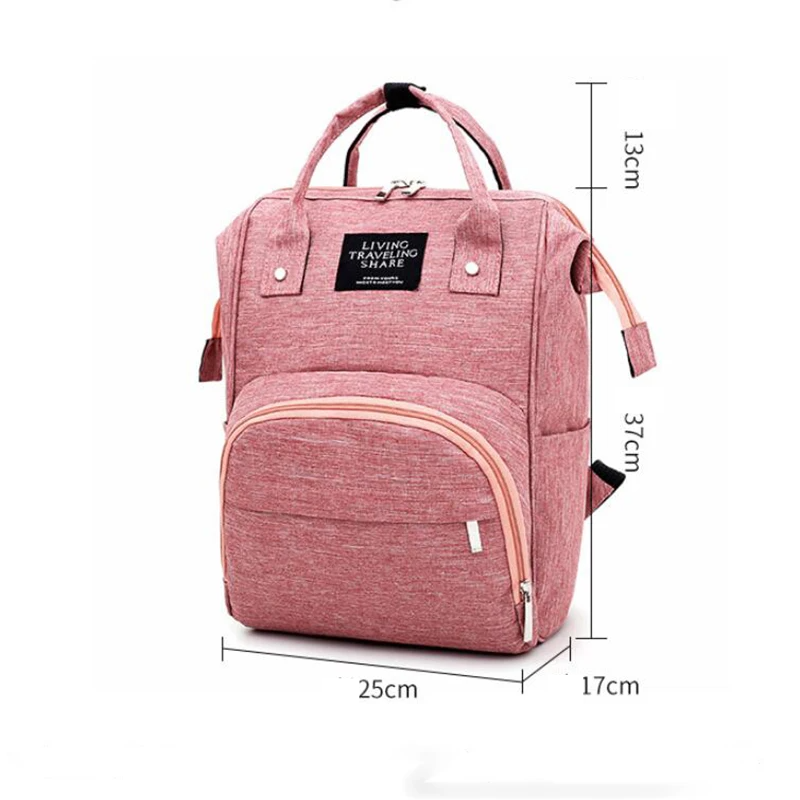 Unisex diaper backpack in green with insulated bottle pockets, waterproof and essential for parenting.