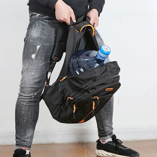 Sleek black waterproof daypack. Perfect for daily commute, travel, & outdoor adventures. Organized storage.